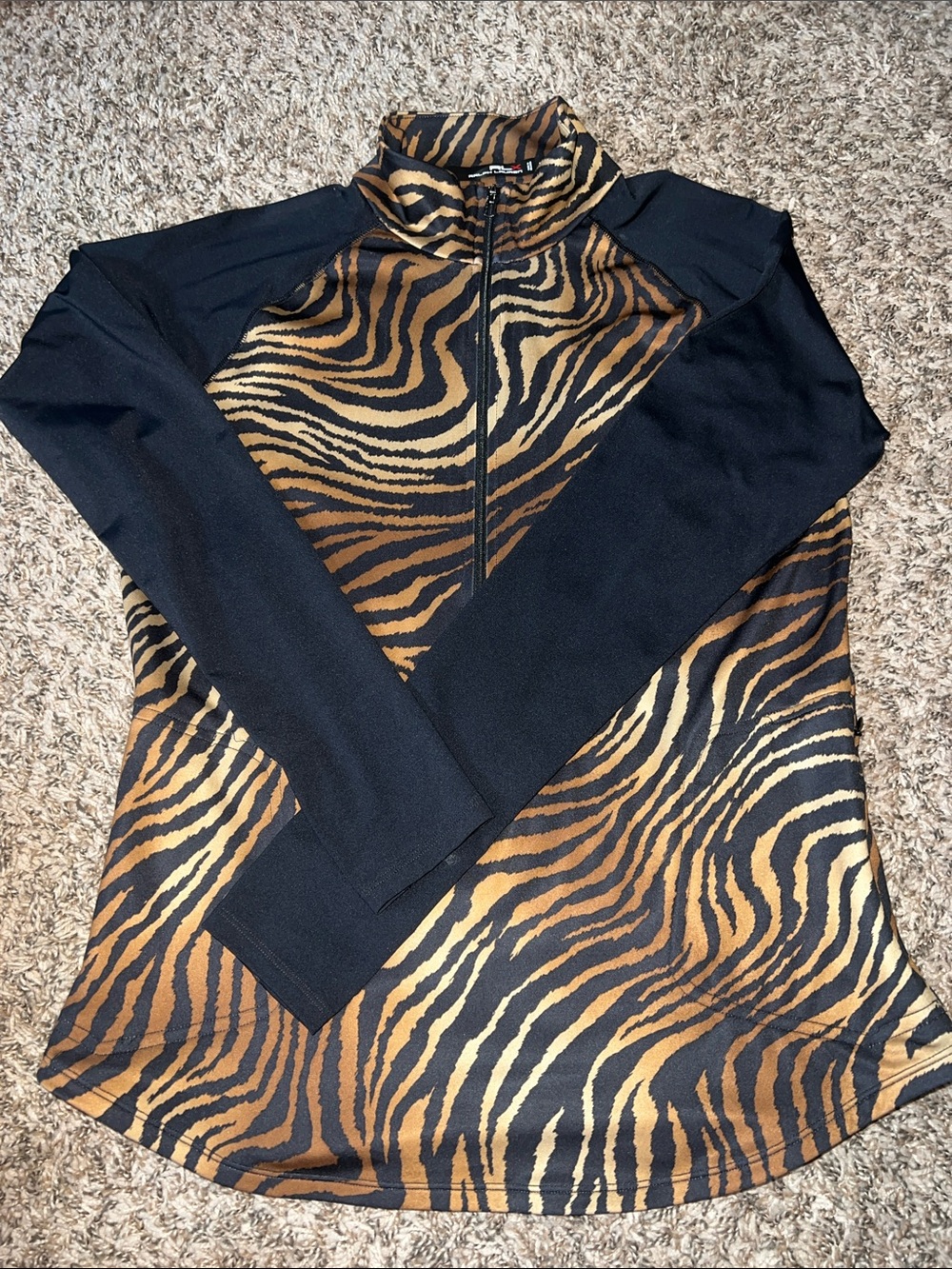 Ralph Lauren three-quarter zip black and tiger print golf shirt.